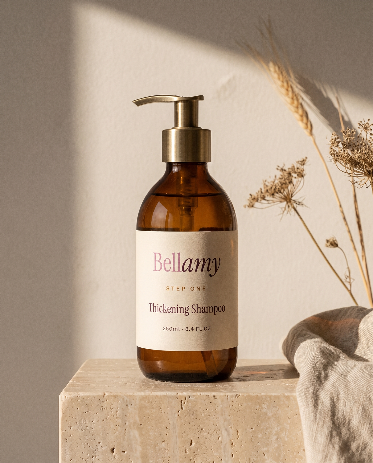 Bellamy Step One Thickening Shampoo, amber bottle with brass pump